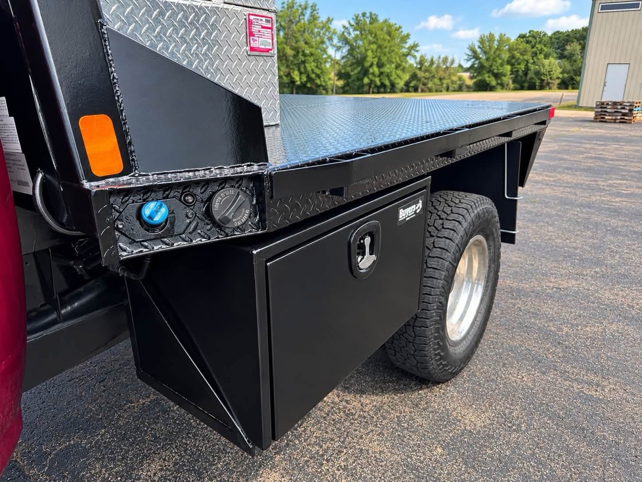 Buyers Products underbody toolbox fitted beneath the CM Truck Bed on the Ram 3500